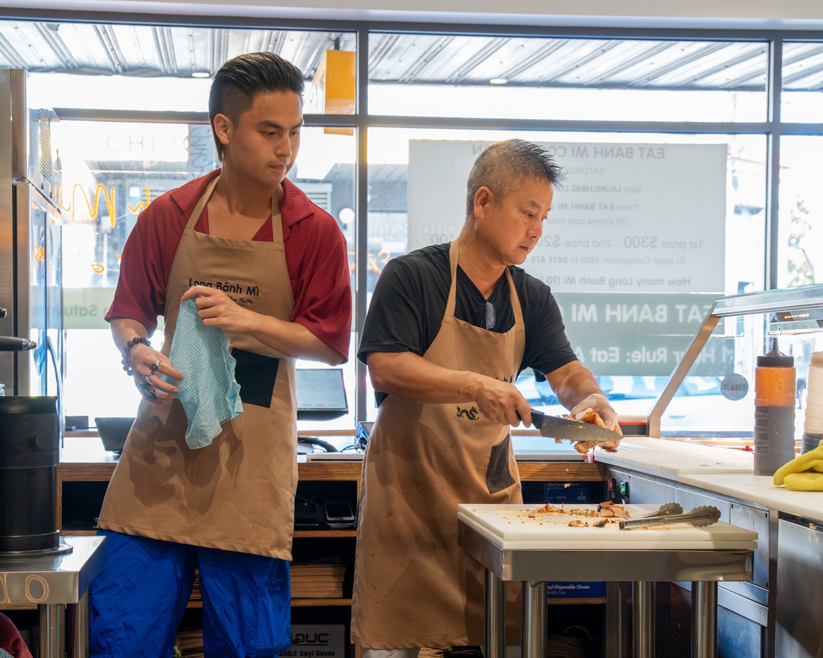 Long Bánh Mì kitchen team preparing bread and fillings